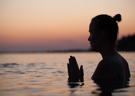 Female Meditating Praying in Water